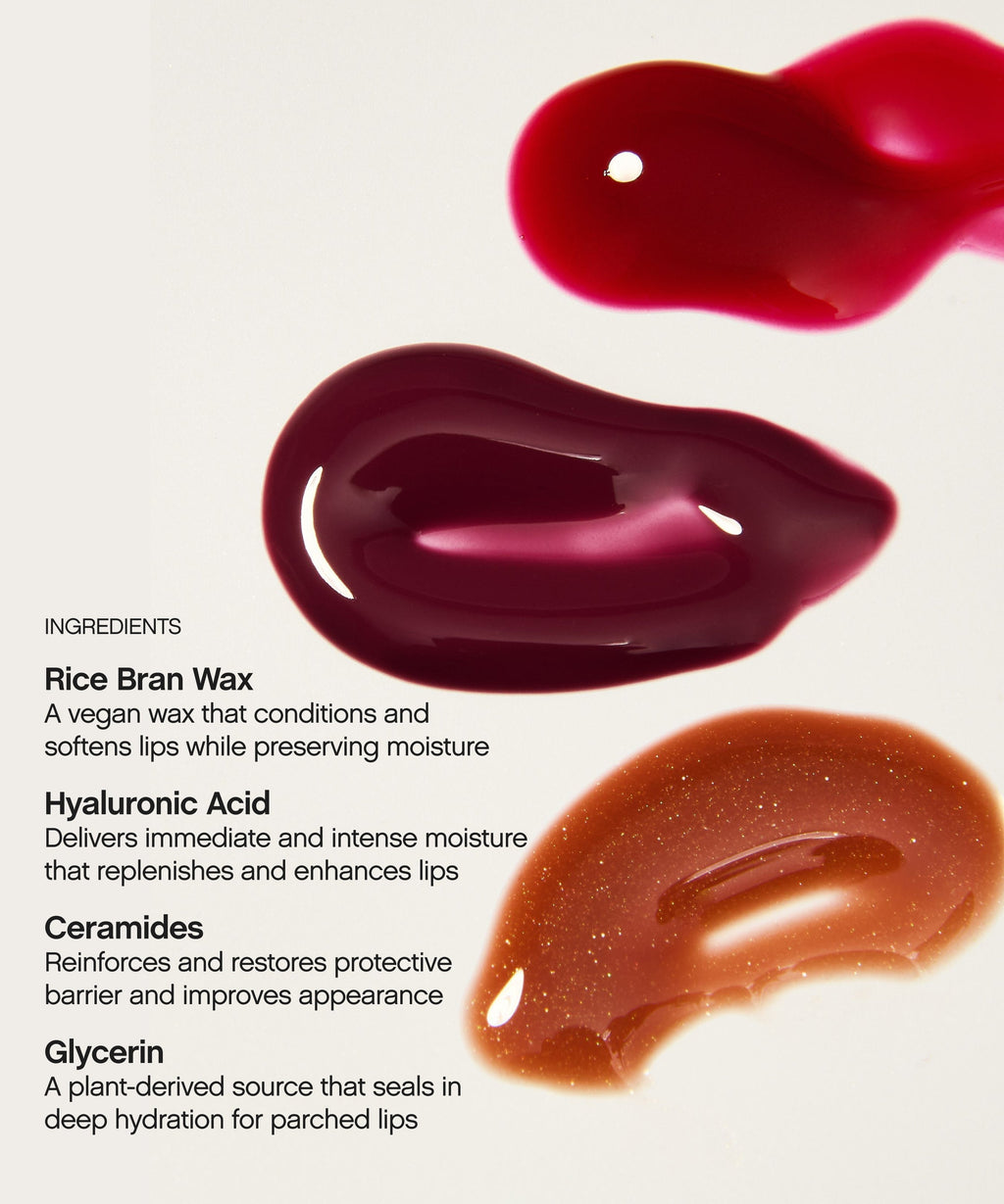 Glossy red, berry, and shimmer-brown swatches of the Topicals Slick Salve hyaluronic acid lip balm trio with key ingredients listed alongside.