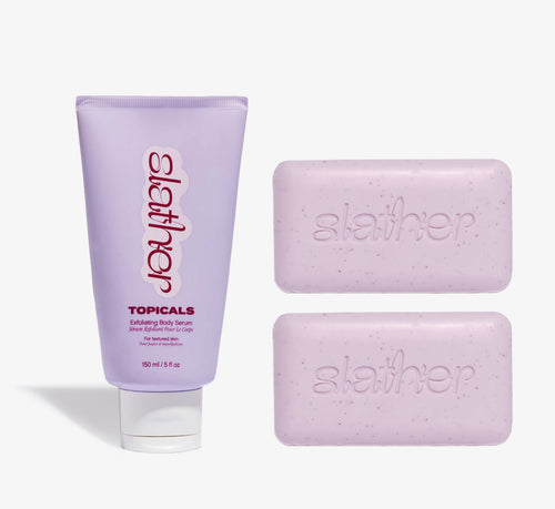 Exfoliating body care bundle from Topicals Slather featuring a lavender 150ml Exfoliating Body Serum tube alongside two pink Slather exfoliating cleansing bars on a white background.
