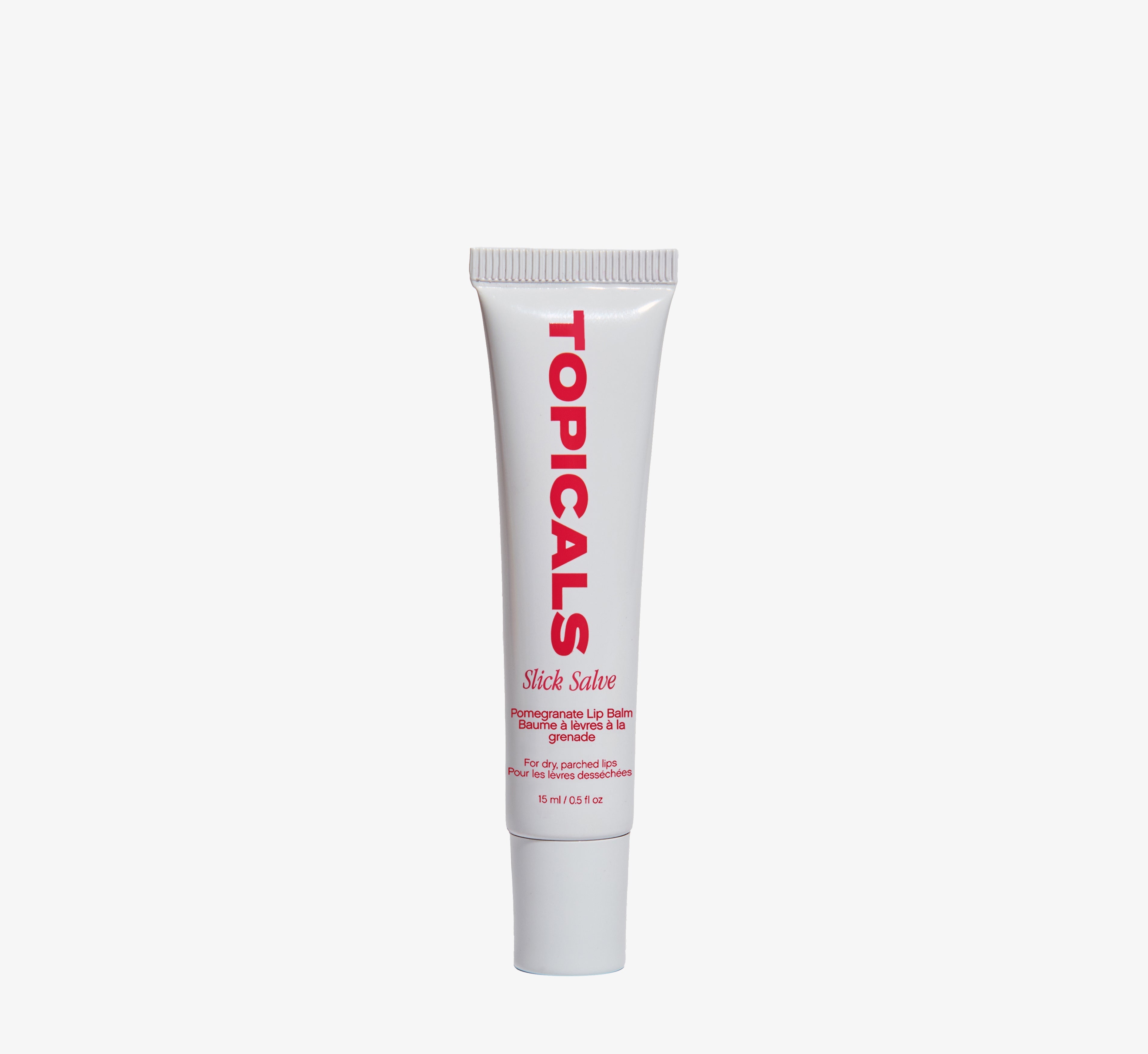 Moisturizing lip balm from Topicals Slick Salve in Pomegranate shown as a single white tube standing upright on a white background.