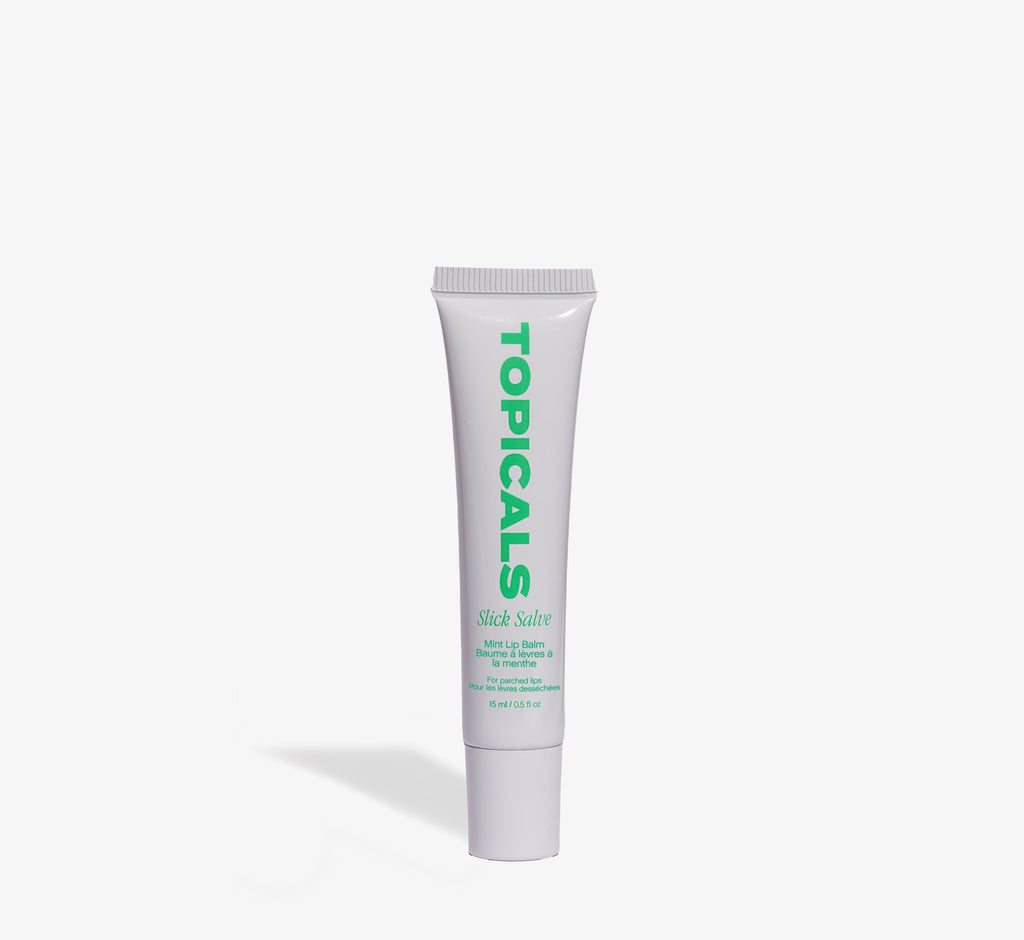 Mint lip balm from Topicals Slick Salve shown as a single white 15ml squeeze tube with green branding on a white background.